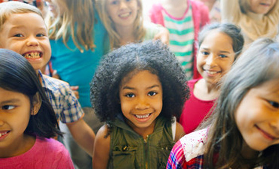 kids standing and smiling